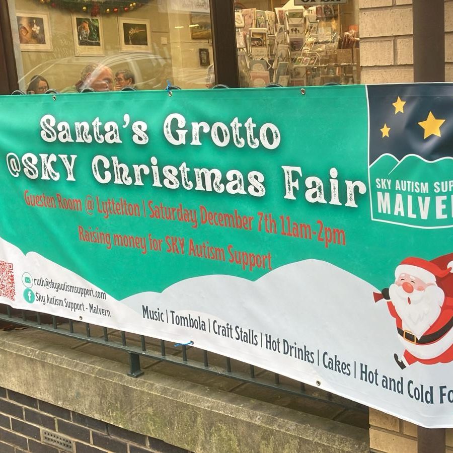 Festive banners for the Santa Grotto at the Sky Autism Christmas Fair, showcasing a joyful holiday atmosphere.